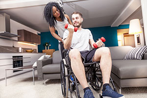 Disabled man in wheelchair with his girlfriend