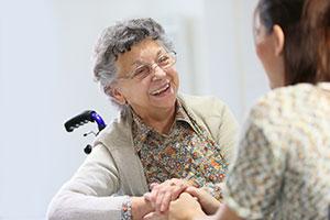 Old lady in wheelchair - Top tips to help someone live independently