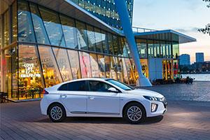 Ioniq in white outside glass building